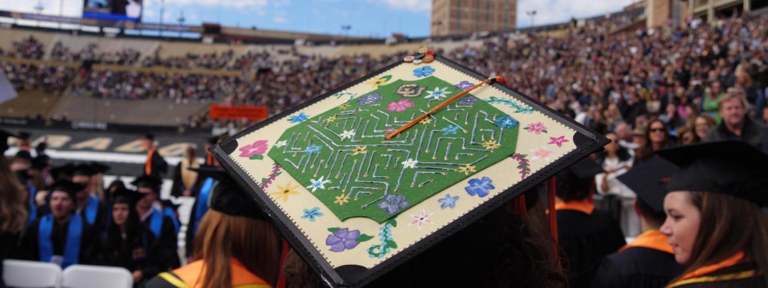 A decorated graduation cap during commencement ceremony